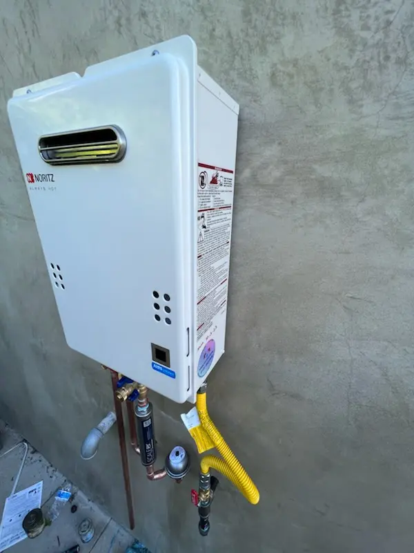 Tankless water heater installation for Hartland Village homes